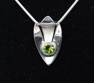 Oval Peridot Pendant in Sterling Silver