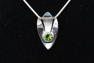Oval Peridot Pendant in Sterling Silver